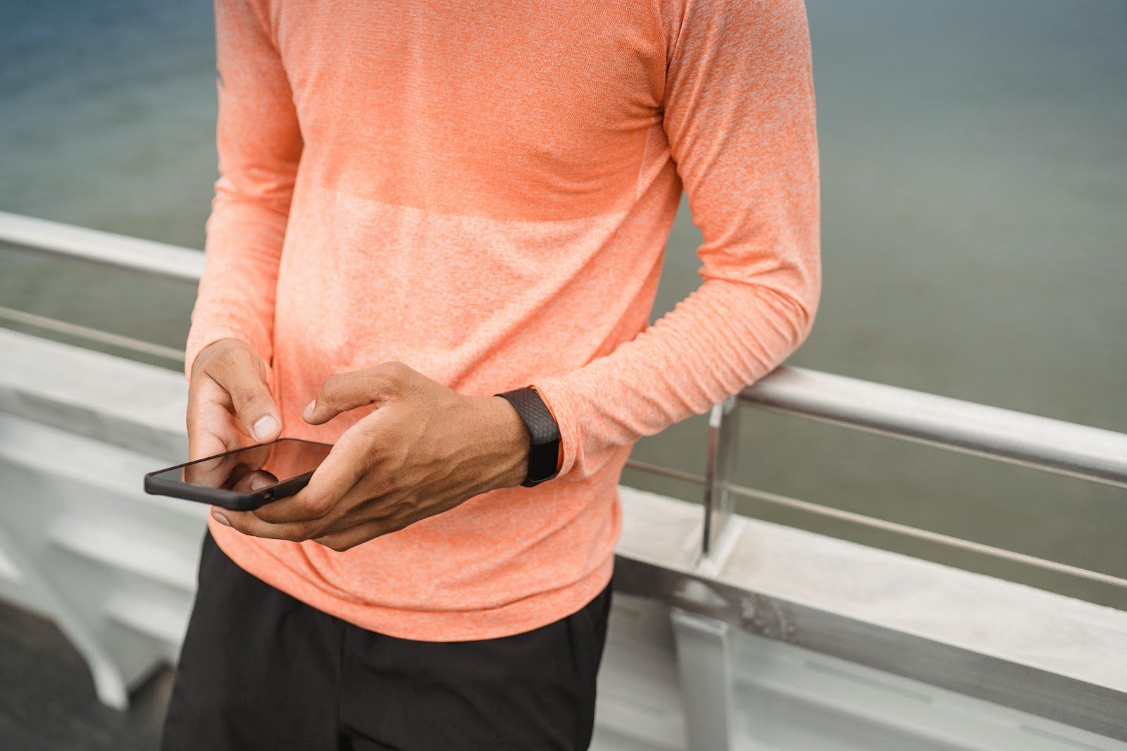 image of a man on his phone