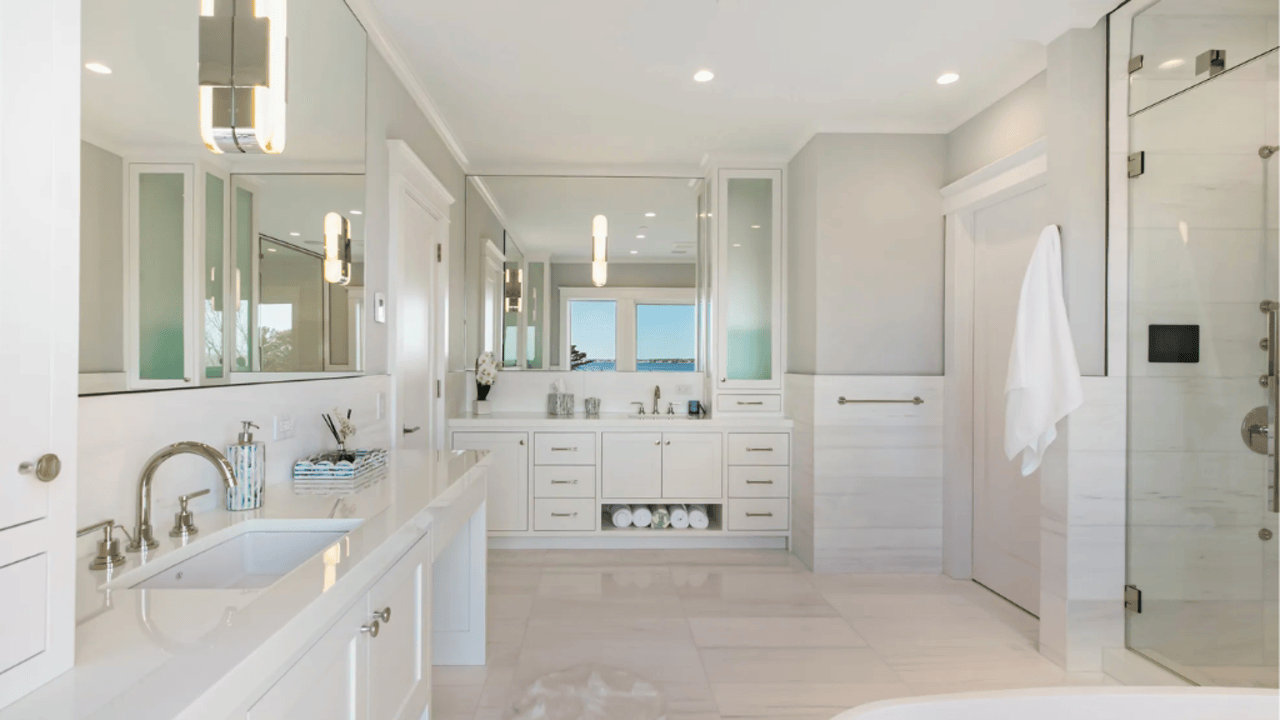 Tour This 8,094 Sq Ft Shingle-Style Waterfront Estate in Quogue, NY with Floating Staircase and 300-Bottle Wine Cellar