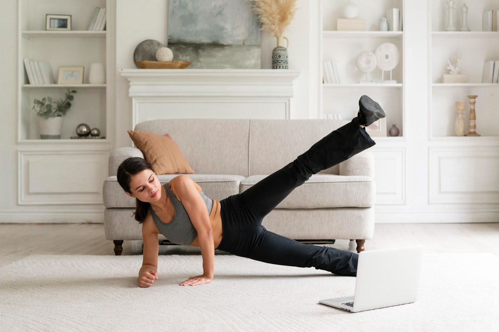 Young woman following home workout routine.