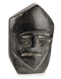 A stone face sculpture on a white background

Description automatically generated