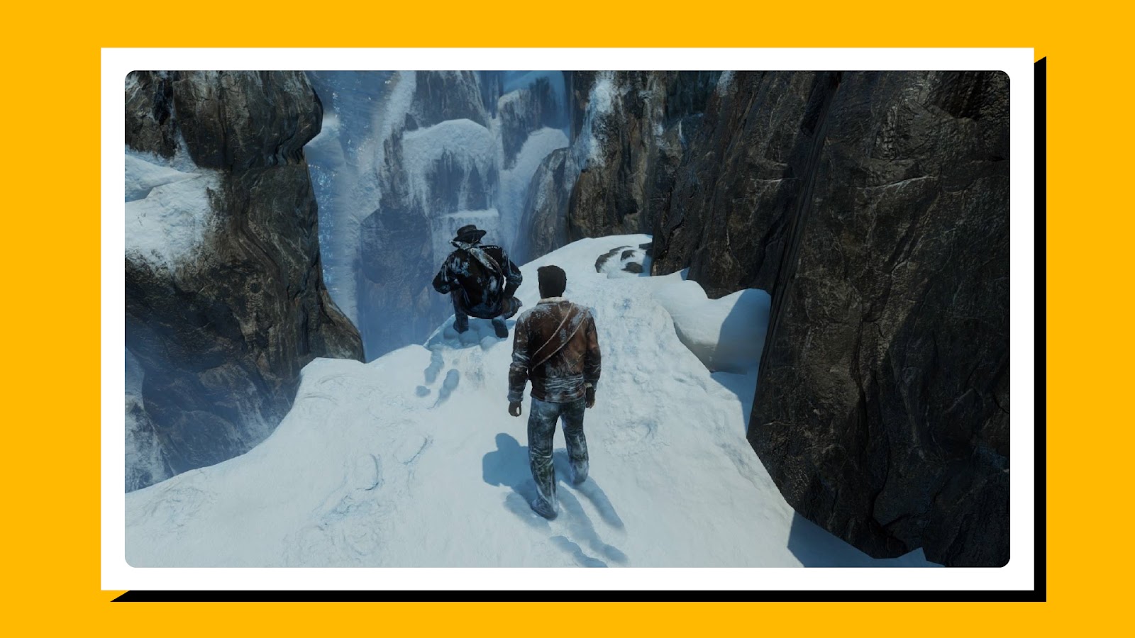 Two characters looking over a snowy mountain cliff in Uncharted: The Nathan Drake Collection