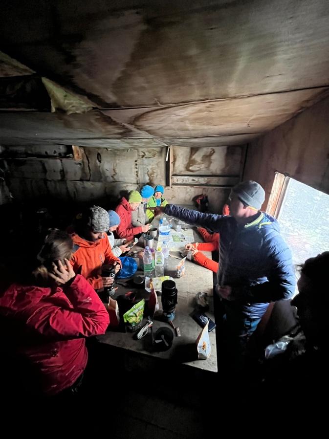A group of people in a cabinAI-generated content may be incorrect.