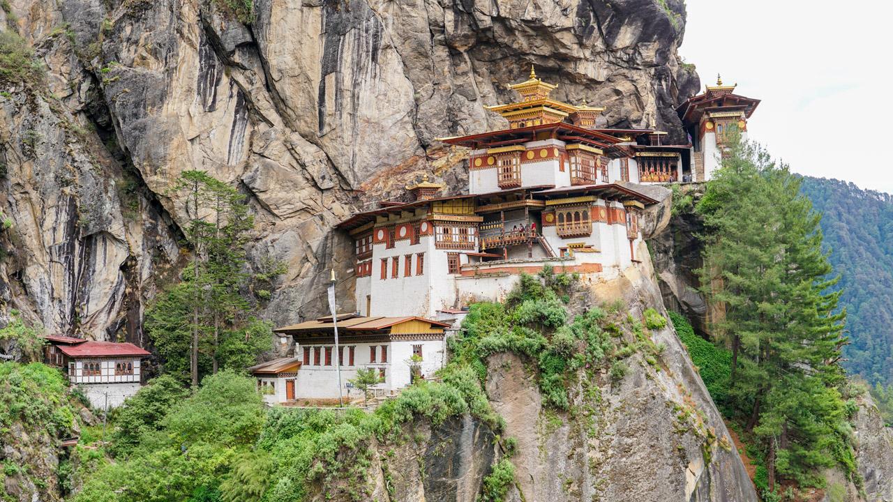 Paro Taktsang on a cliffDescription automatically generated