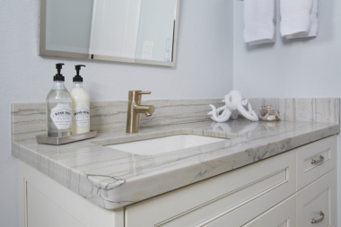 how to select the perfect countertops for your bathroom remodel quartzite countertop with white drawers and single vanity custom built michigan