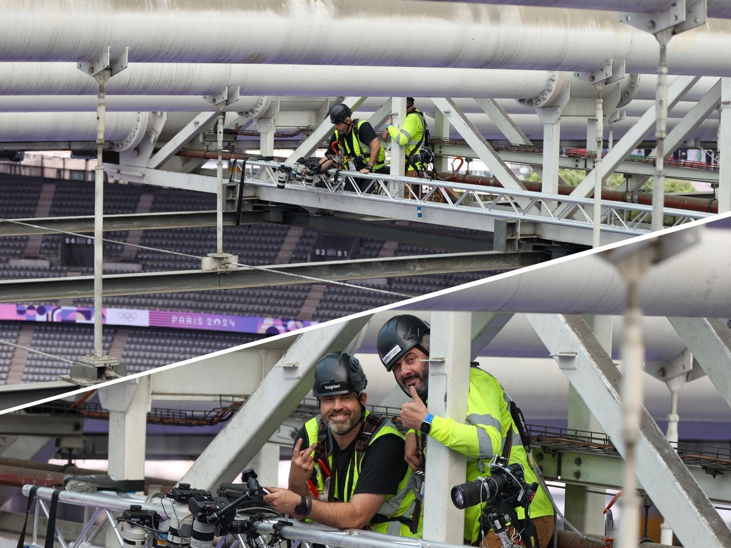 A person in a safety vest leaning against a metal structure

Description automatically generated