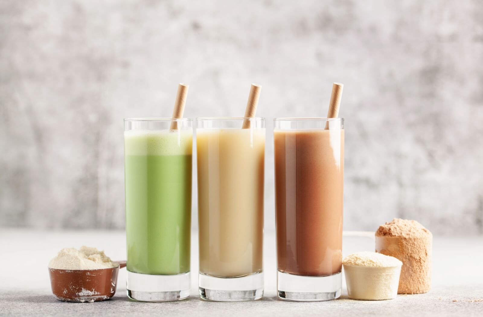 An image with 3 examples of healthy-looking protein smoothies.