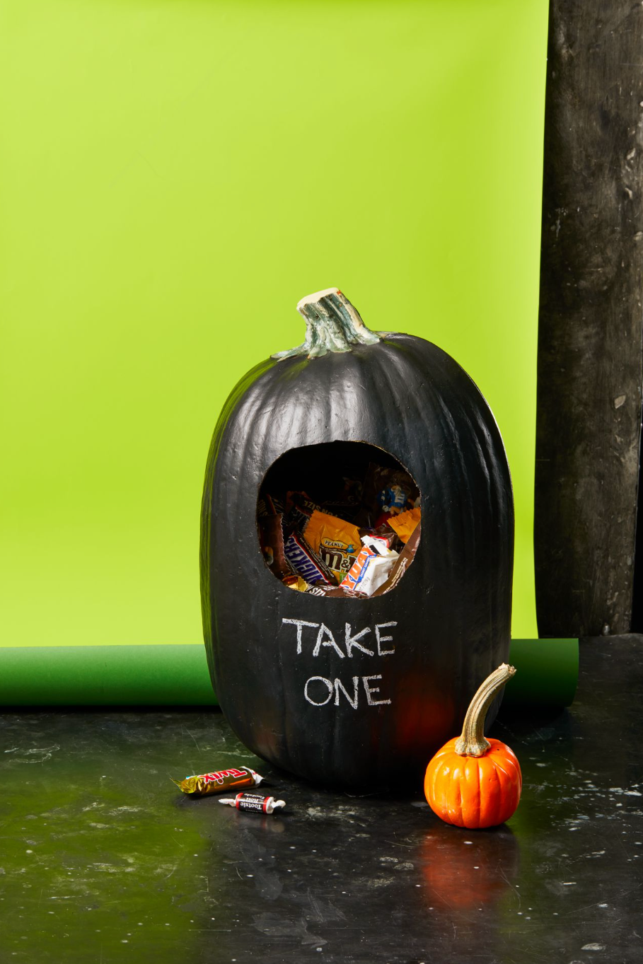 diy halloween decorations, black pumpkin with candy inside