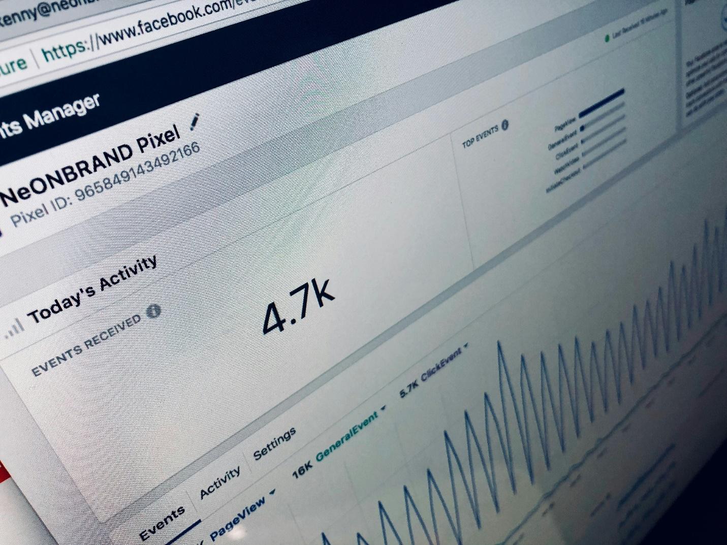 A laptop screen with Facebook analytics