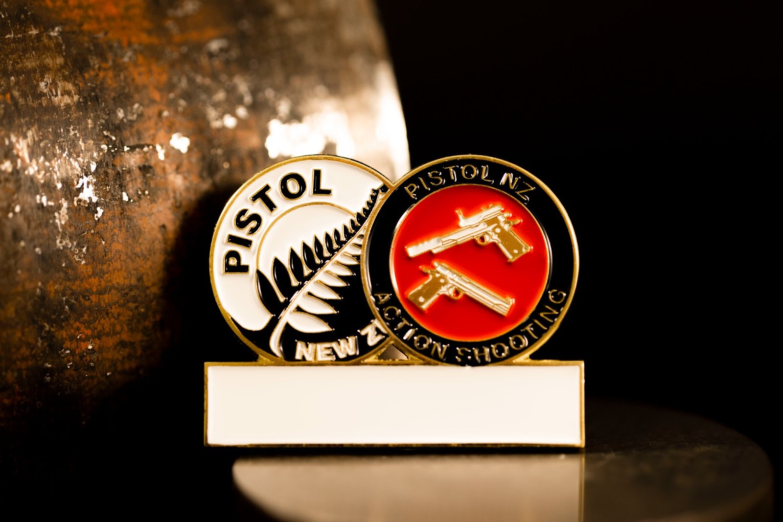 Custom lapel badge for Pistol New Zealand.