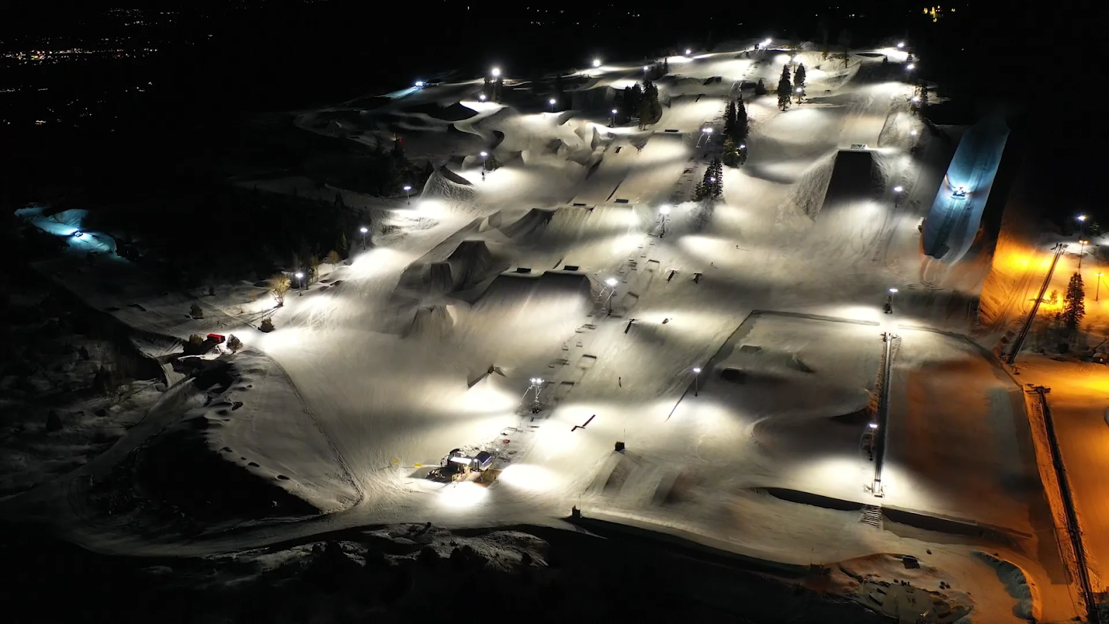 an image of Woodward Park City lit up at night showing everything they have to offer for night riding
