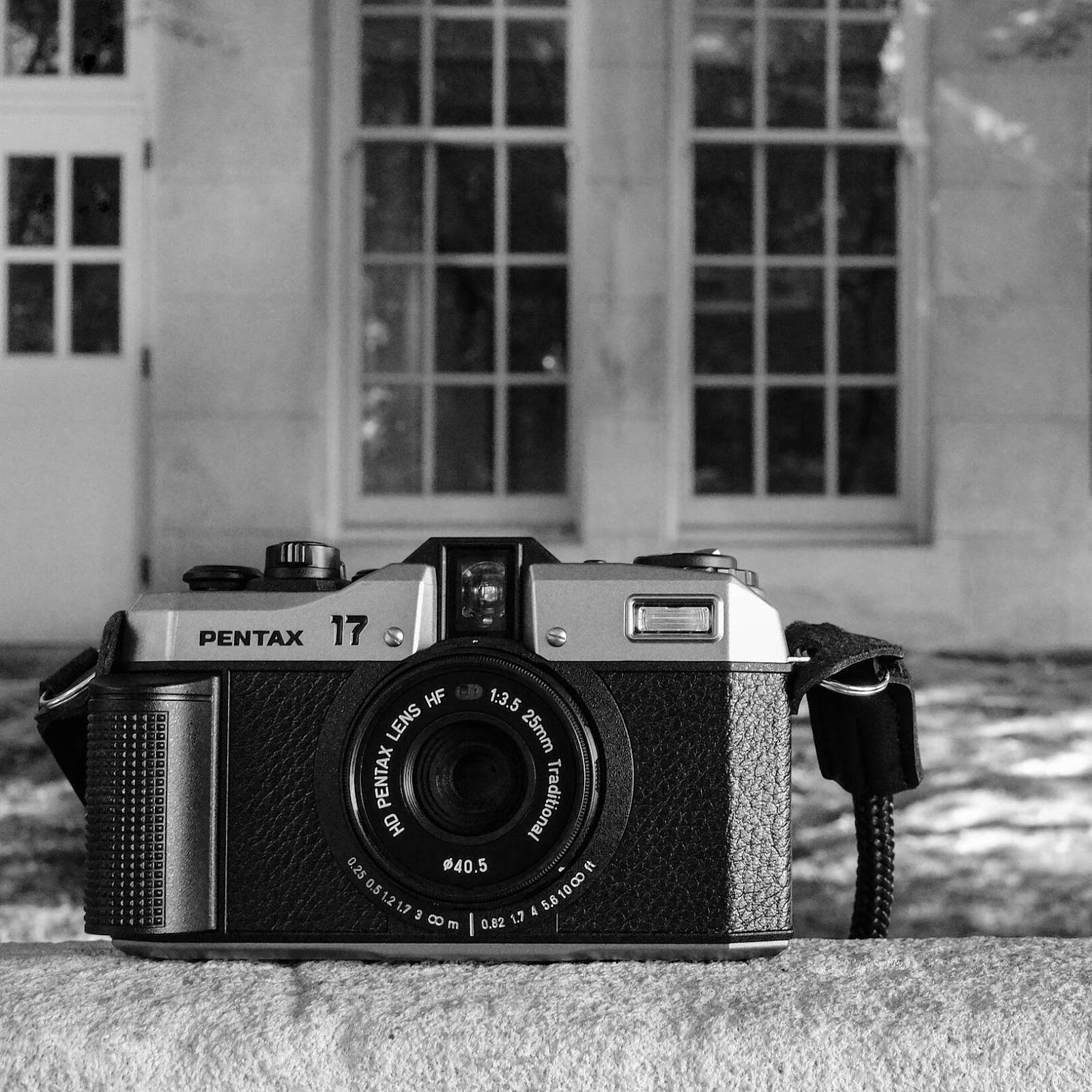 A camera on a stone ledge

Description automatically generated