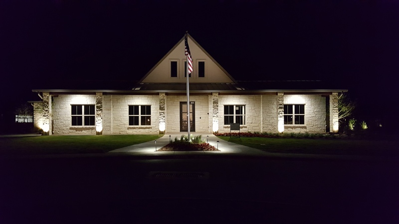 A home illuminated with outdoor lighting.