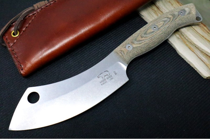 An image showing the White River Camp cleaver with a wide, curved blade and a sturdy handle—ideal for heavy-duty tasks like chopping and slicing.