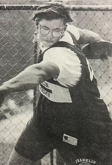 Photo of Bryan Law throwing a discus