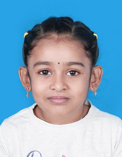 A child with pigtails and earrings

AI-generated content may be incorrect.
