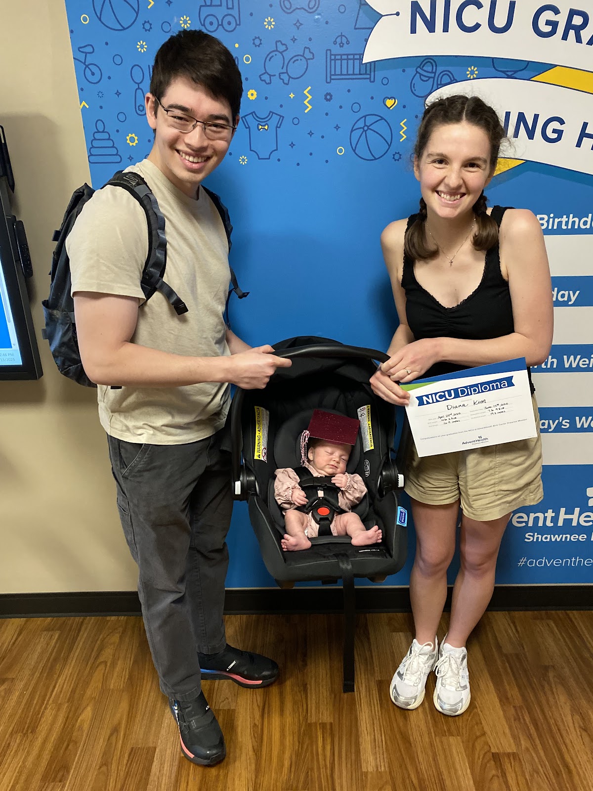 New mom and dad leave the NICU with their baby.