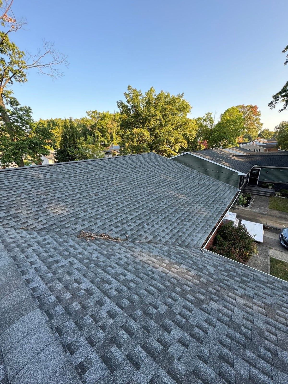 Close-up of asphalt shingles, a common material in roof installation, demonstrating durability and weather protection.