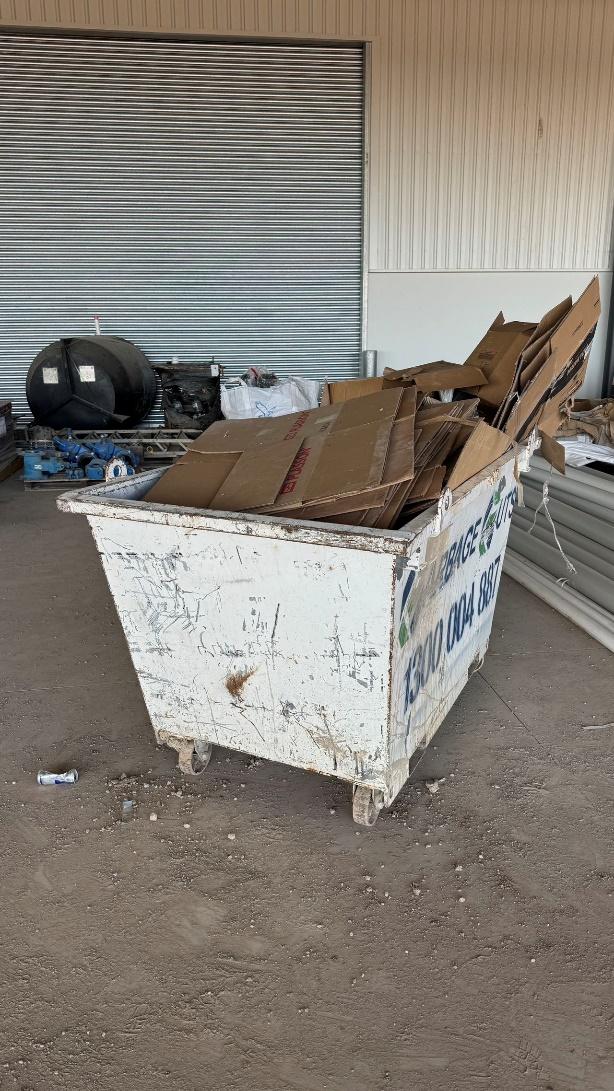 A large white container full of cardboard

Description automatically generated