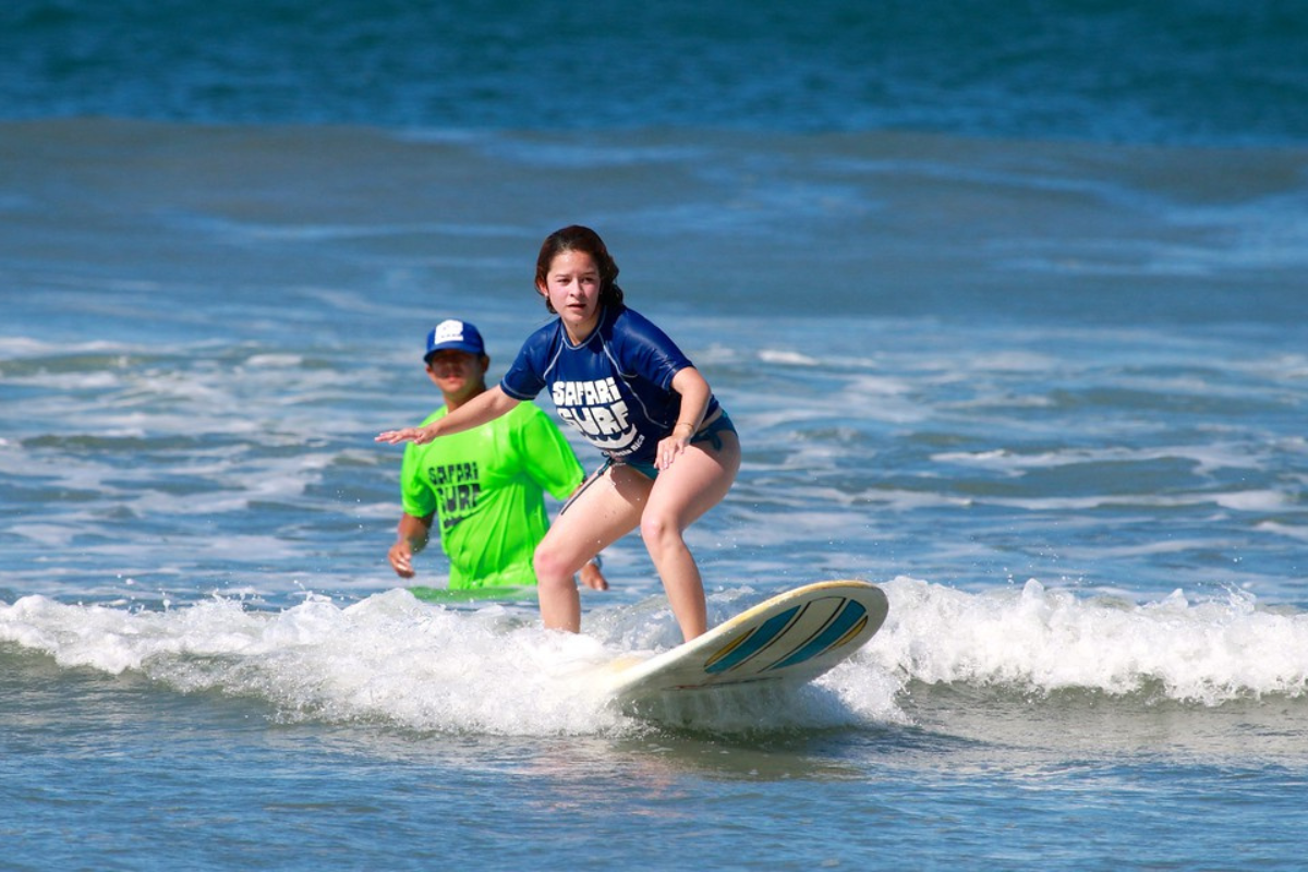 a girl surfing in Brasilito Costa Rica