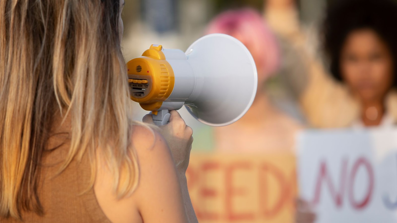 Woman talking into a megaphone