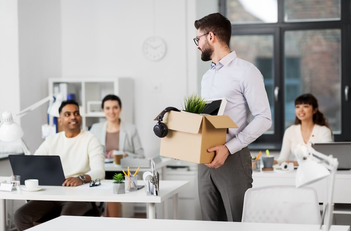 Leave of absence Texas: employee carrying a small box of his belongings