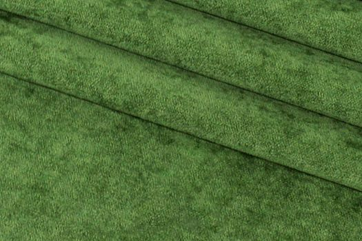A close-up of a dark green chenille fabric.