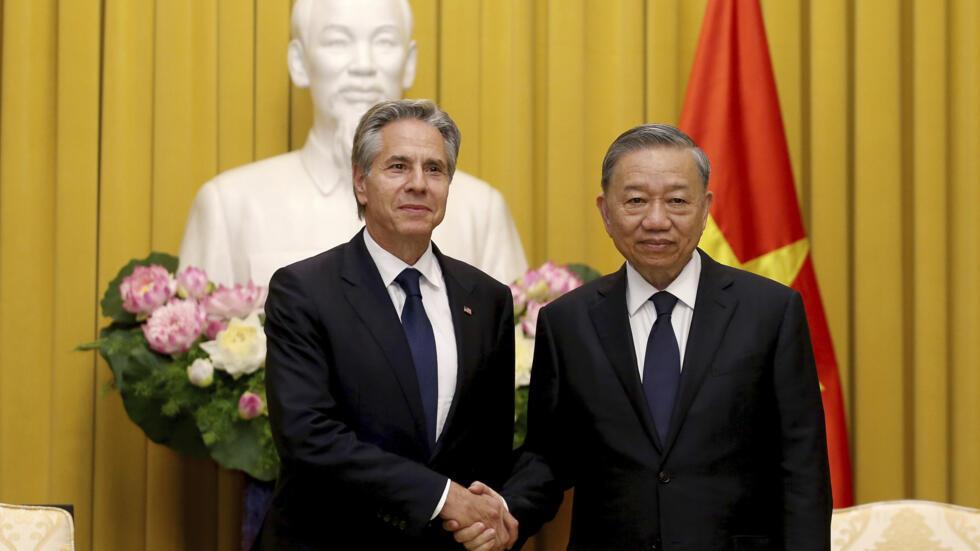 Vietnamese President To Lam, right, shakes hands with US Secretary of State Antony Blinken, at the Presidential Palace in Hanoi, Vietnam, Saturday July 27, 2024. (Luong Thai Linh/Pool Photo via AP)