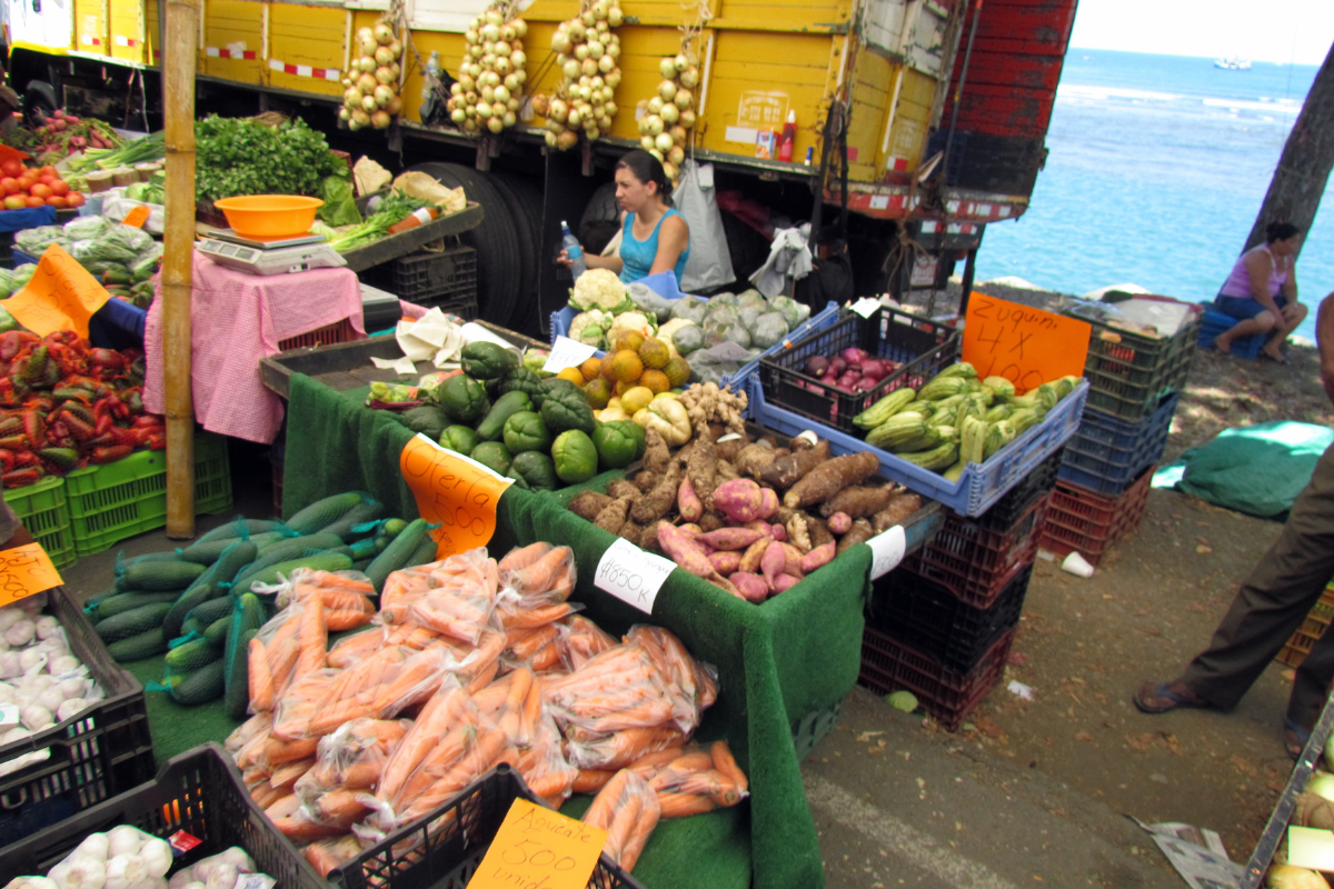 A lady selling fruits and vegetables in farmers market in Brasilito Costa Rica