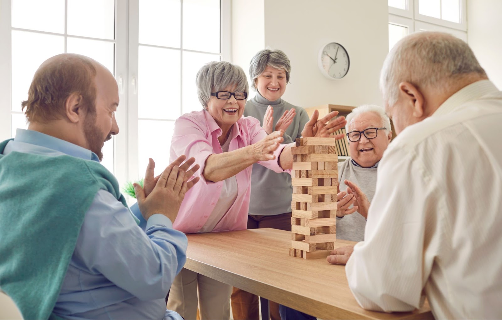 a group of seniors playing games at their retirement community.