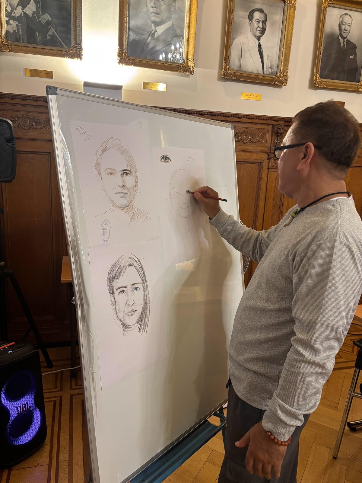 A person drawing on a white boardAI-generated content may be incorrect.