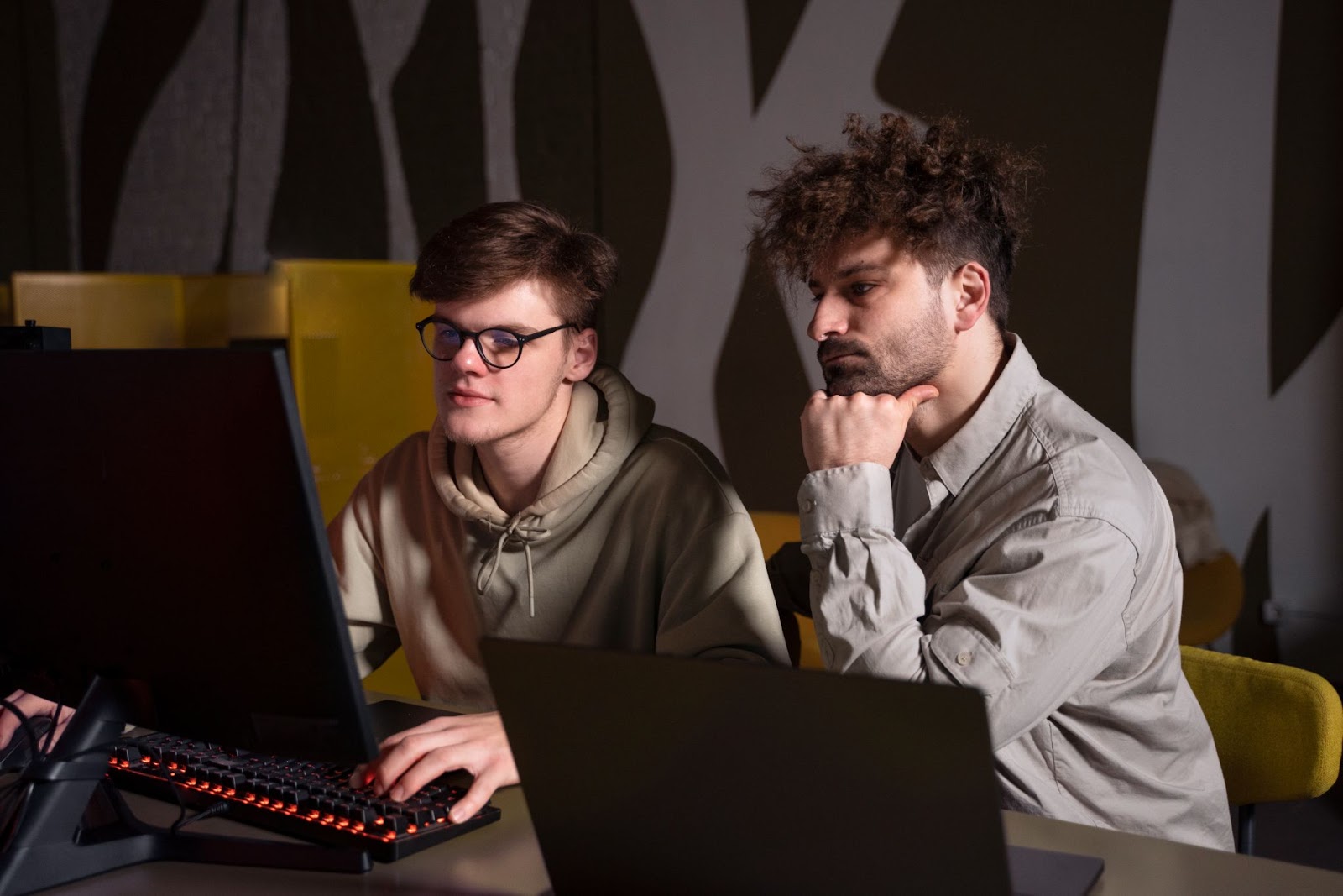 A collaborative team of developers working on an animation project, illustrating the teamwork aspect of vibe coding.