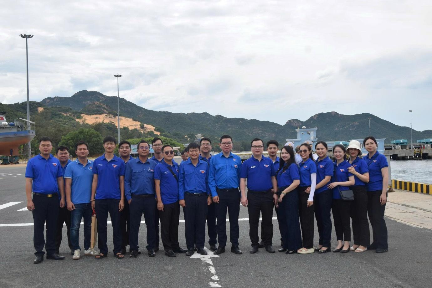 A group of people in blue shirtsAI-generated content may be incorrect.