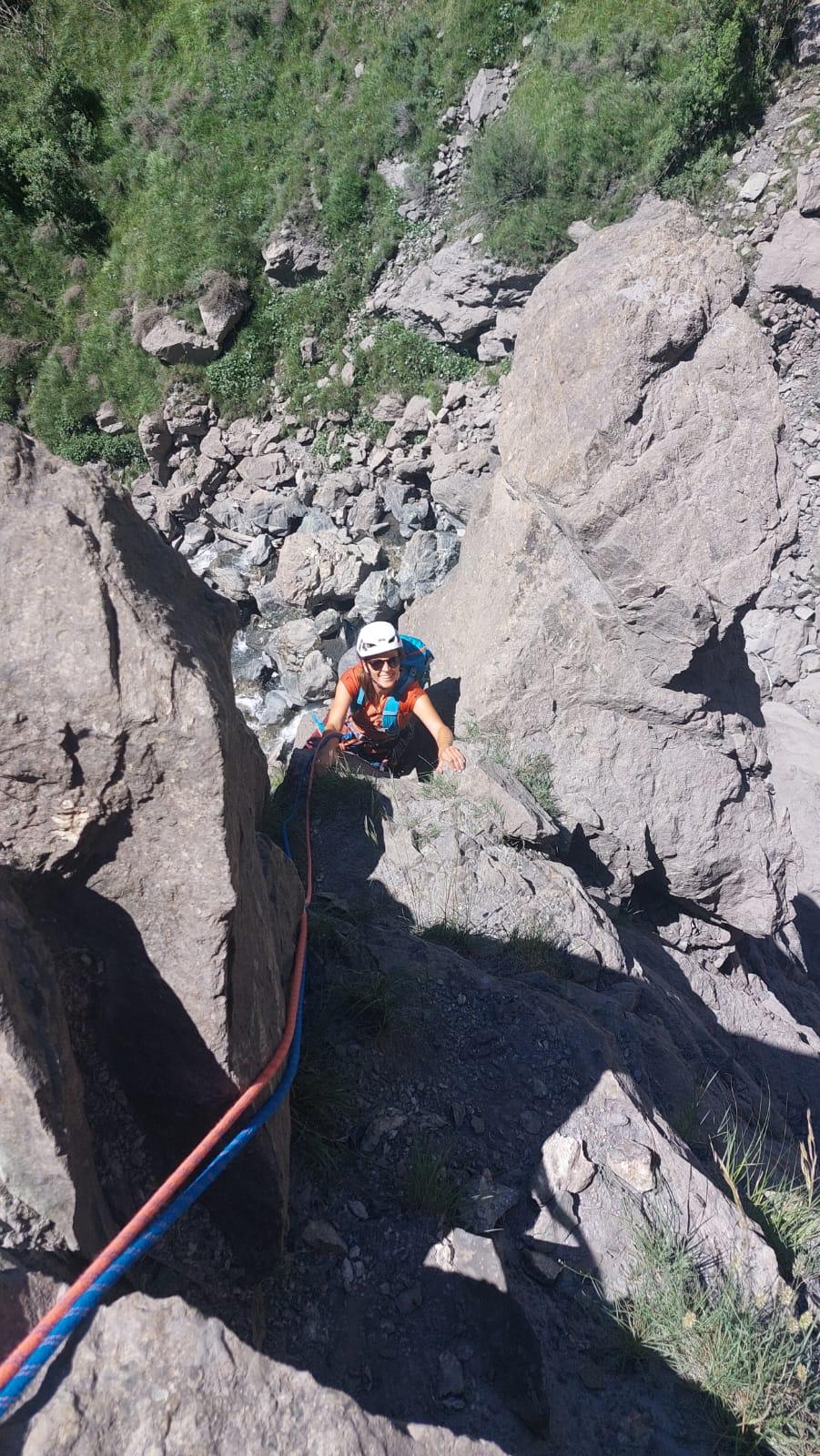 A person climbing a rockAI-generated content may be incorrect.