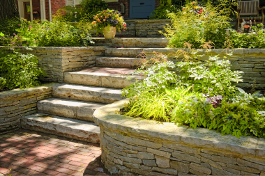 michigan hardscaping ideas for every season raised stone planters with foliage custom built okemos