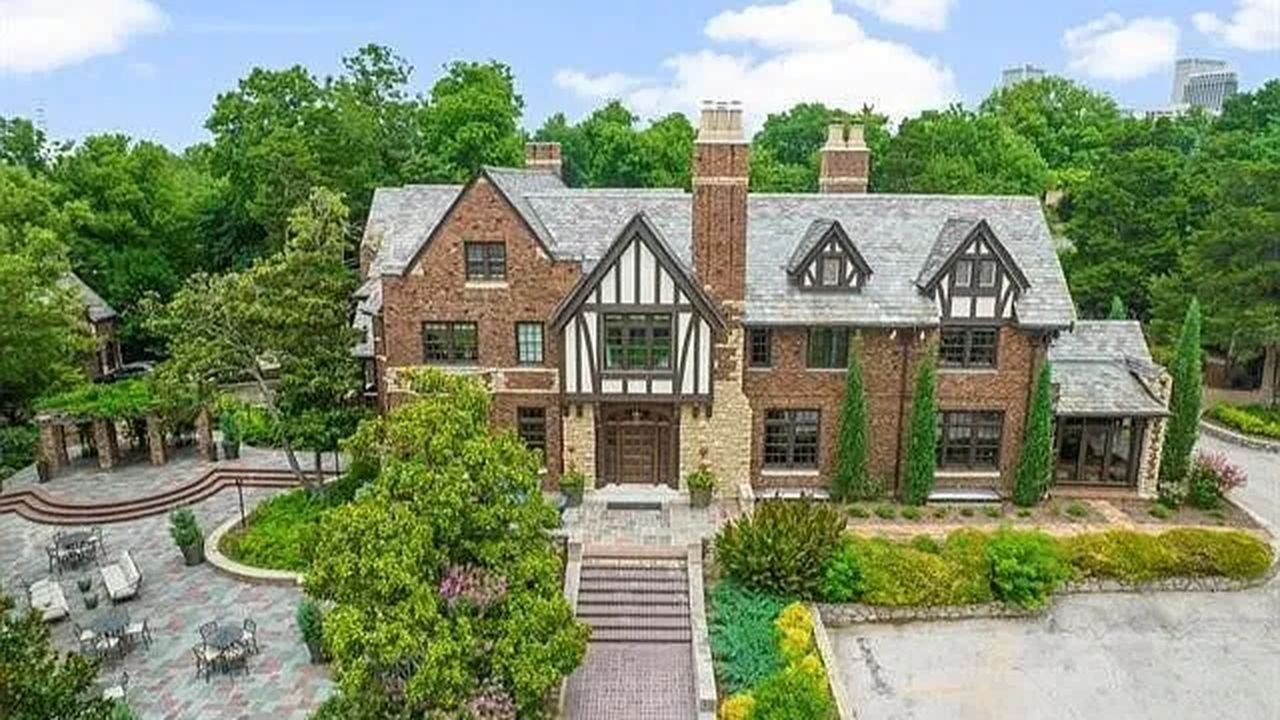 A Rare 1928 Tudor Mansion in Tulsa with Historic Charm, Soaring Ceilings, and 3 Acres of Lush Landscaping and Scenic Views