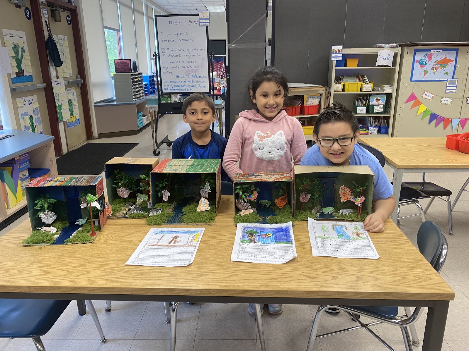 Students with their 3D dioramas of various habitats