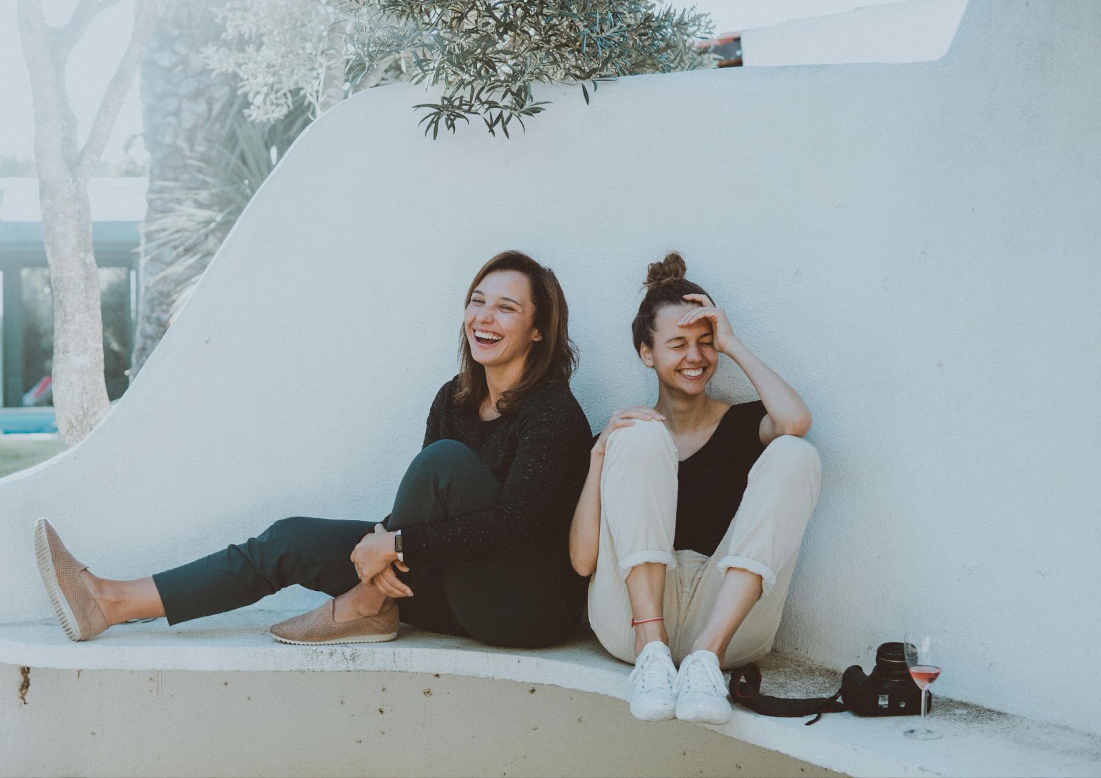 mental health issues two female friends laughing together