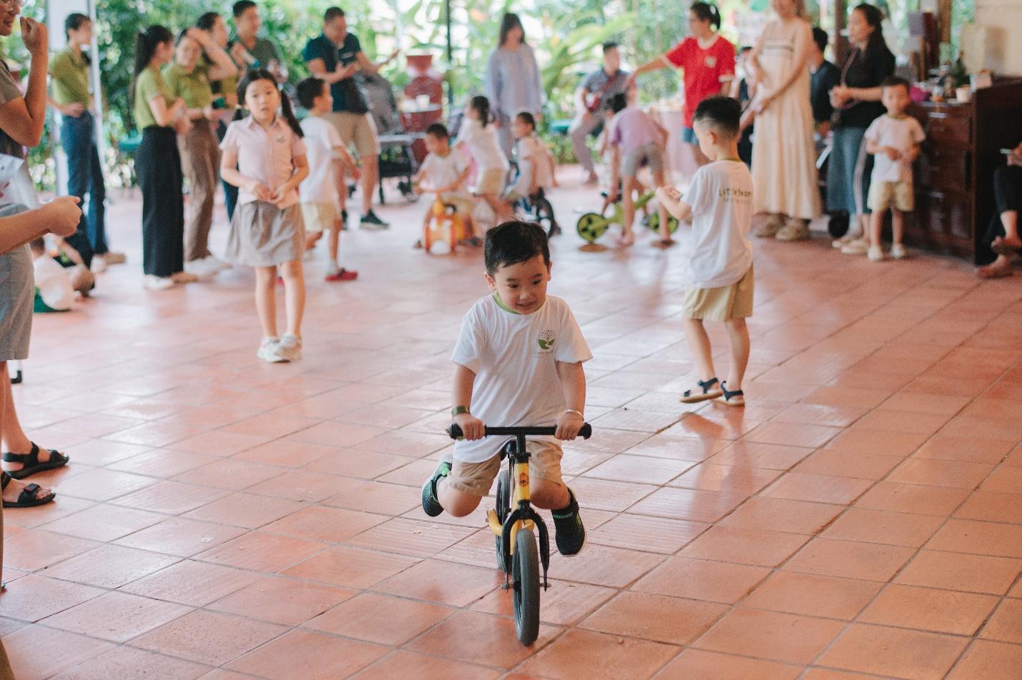 A child riding a bike with other children