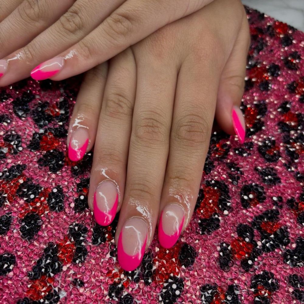 Close up of nails with simple pink nail designs having Hot Pink French Tips