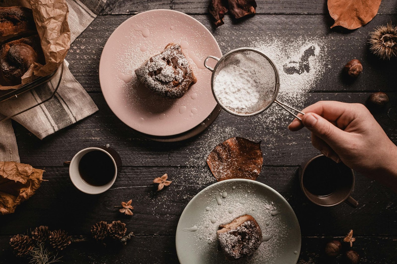 A picture of a sugary treat with coffee on a table