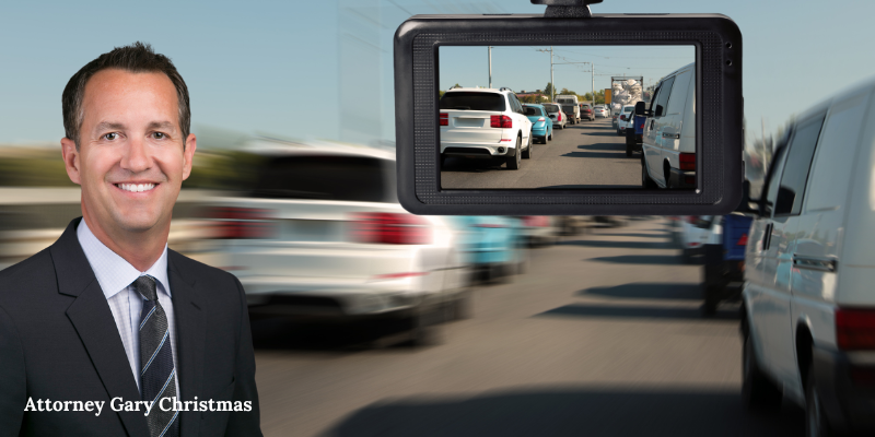Car accident lawyer Gary Christmas in front of dashcam footage in car accident