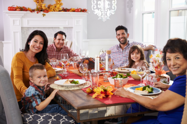 how a home remodeling project can positively impact your family thanksgiving dinner at kitchen table in remodeled dining room custom built michigan