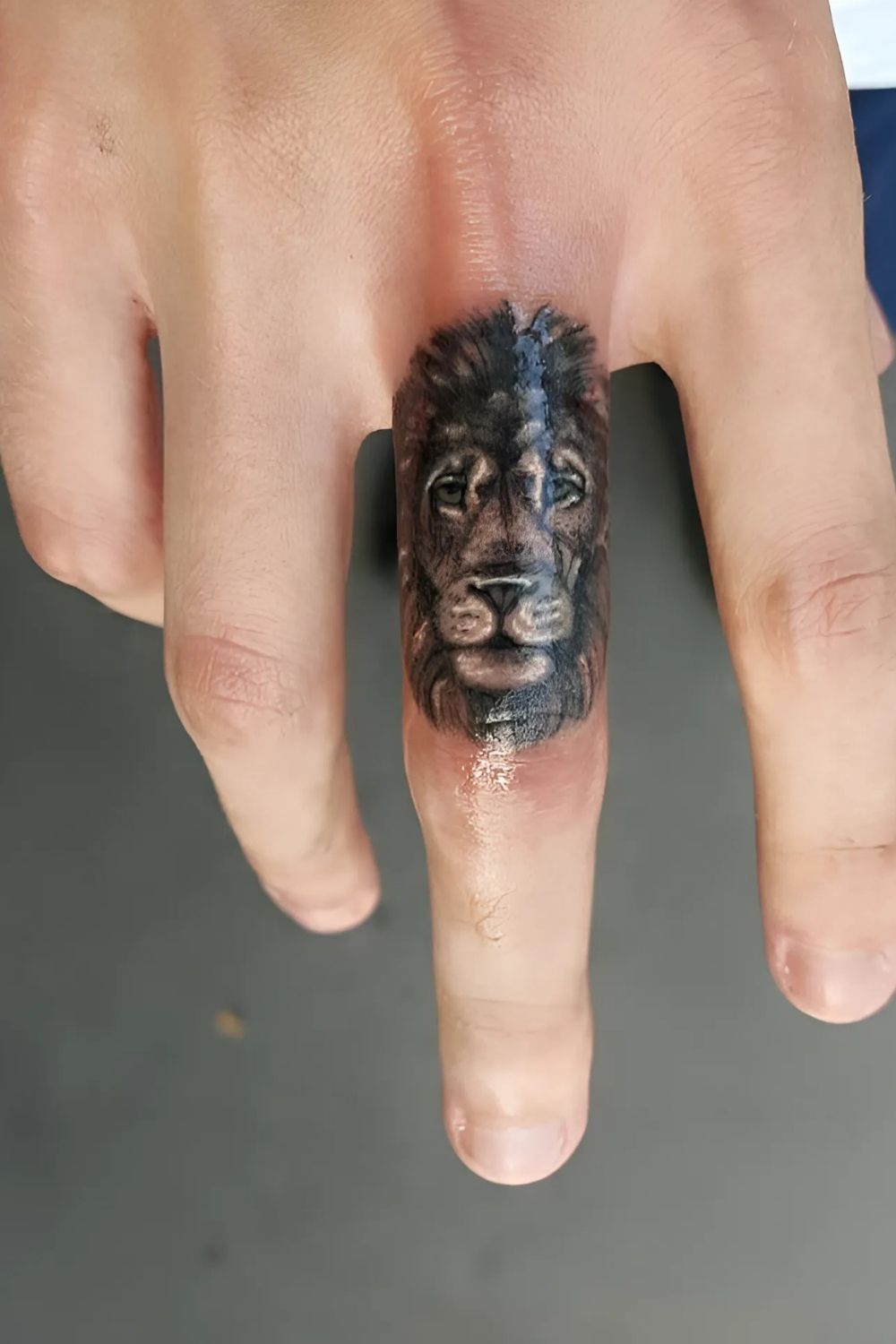 Majestic Lion Finger Tattoo