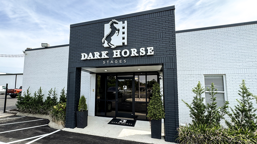 exterior dimensional sign that says dark horse stages