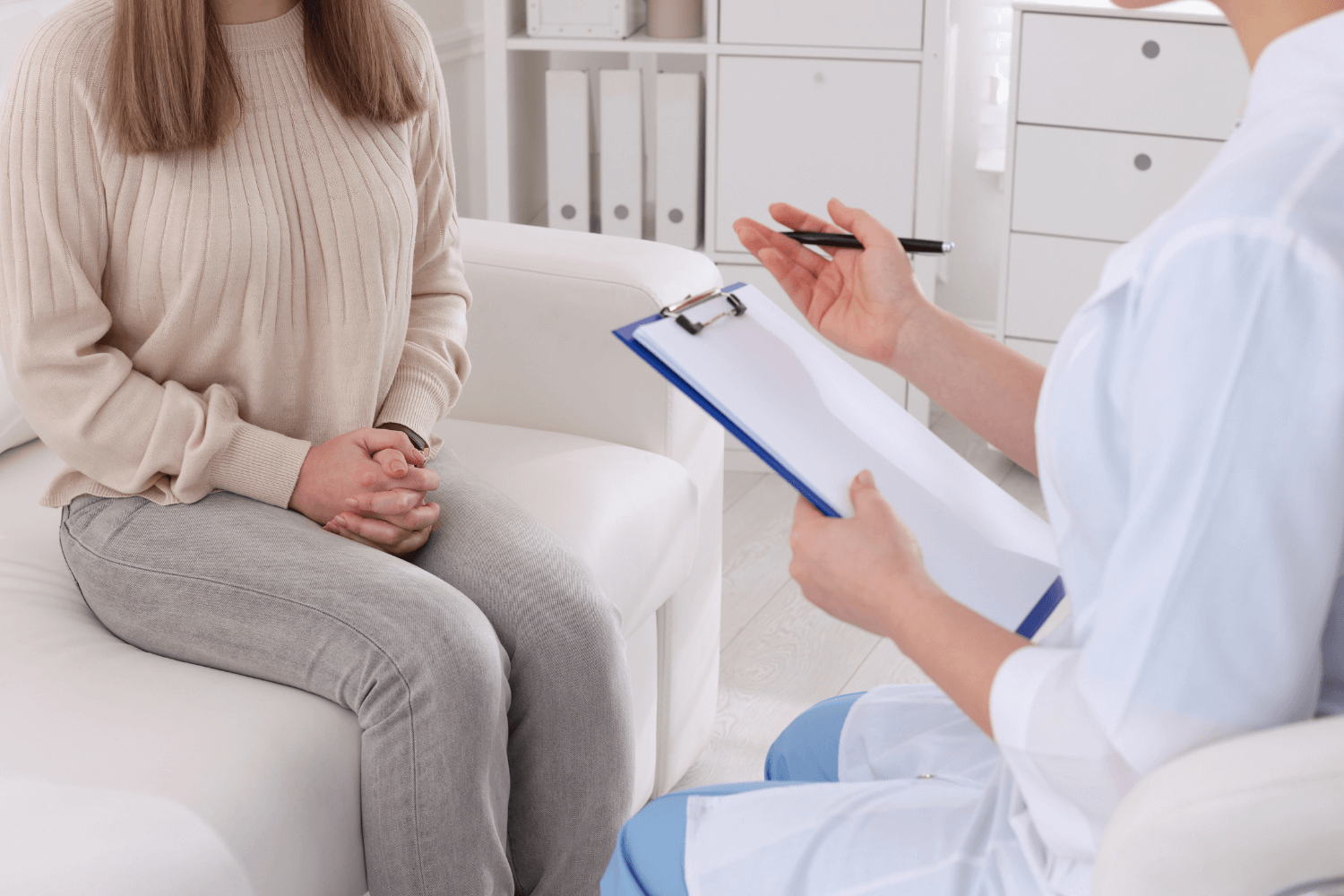 woman sitting across from a doctor at her office