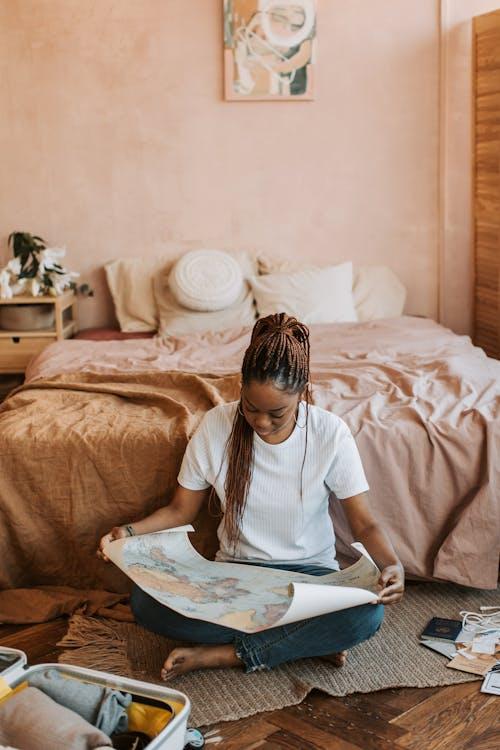 Free Woman Looking at a Map Stock Photo