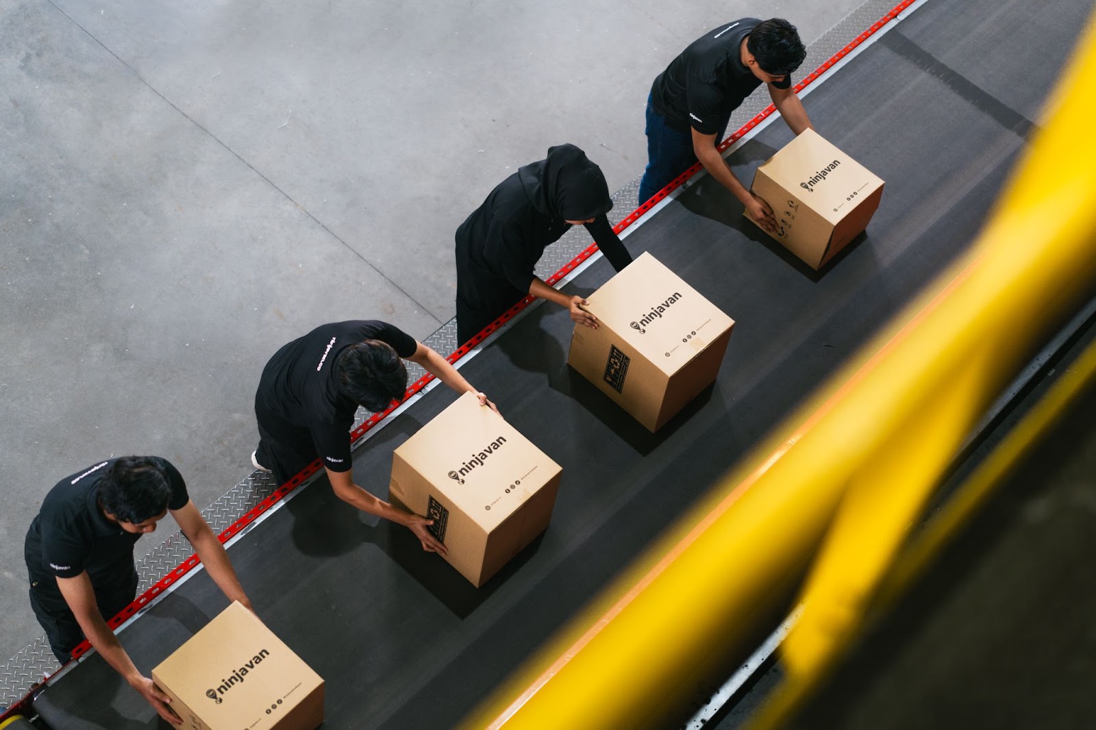 Rows of FMCG products in a warehouse ready to be sorted for order fulfillment.