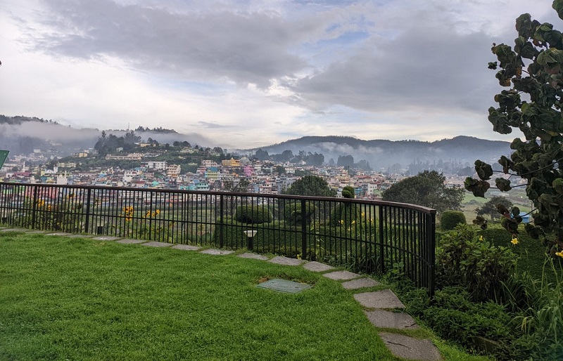 Charming view of Ooty, Tamil Nadu, with lush green landscapes, colonial-era buildings, and scenic Nilgiri mountain railways.