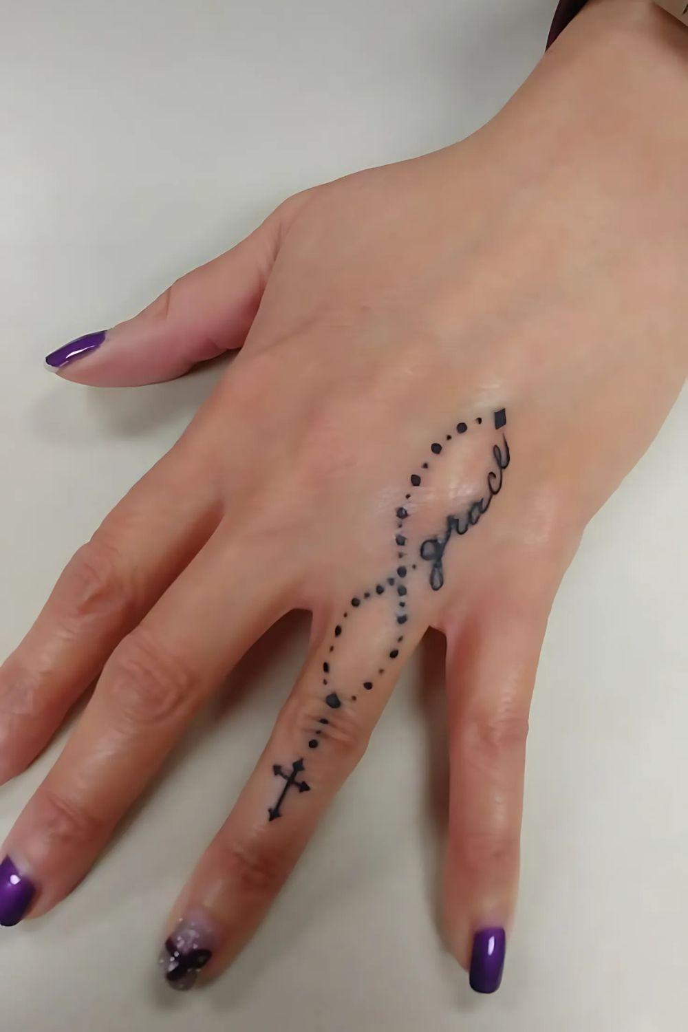 Rosary Finger Tattoo