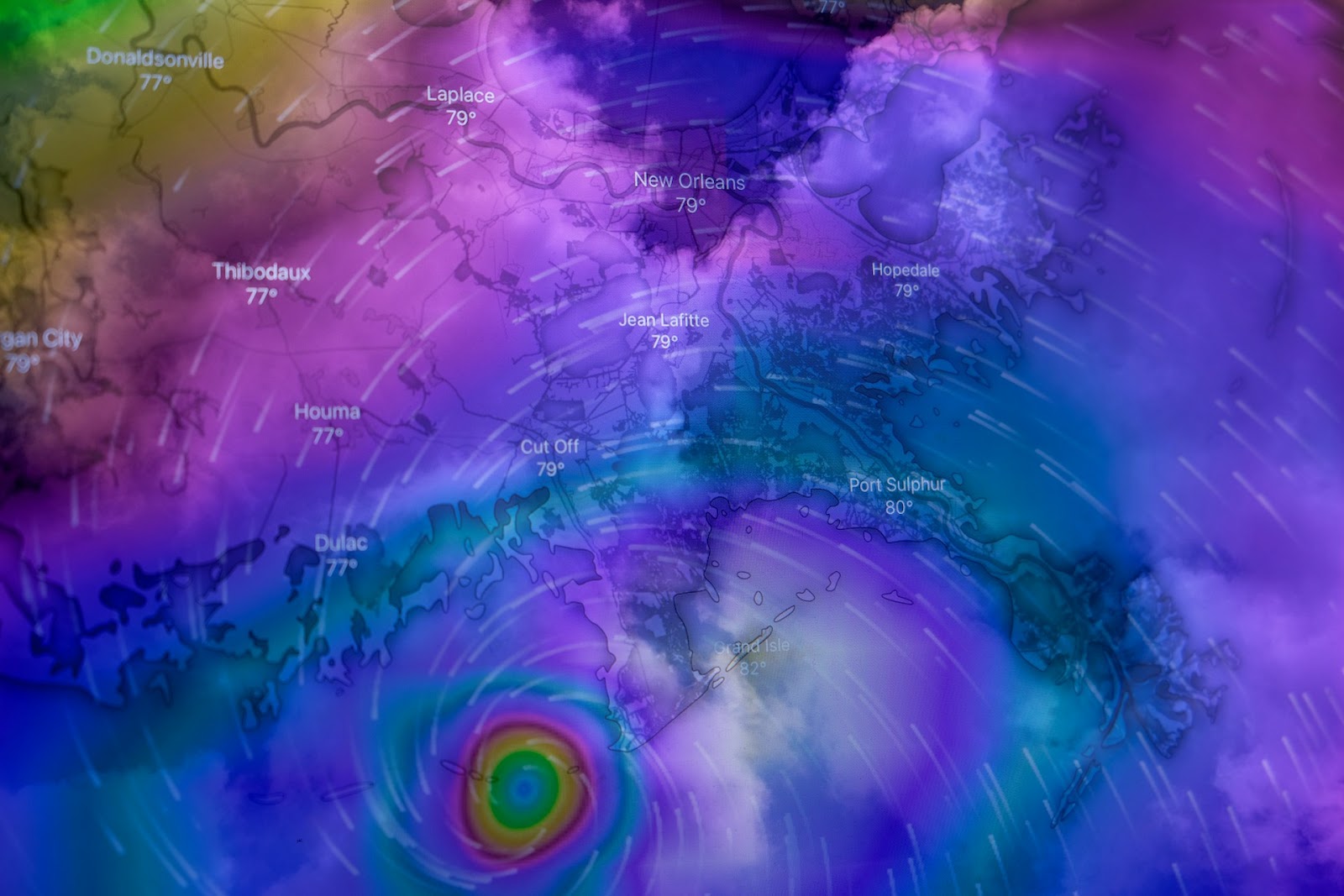 A colorful meteorological map shows a vivid hurricane approaching the Louisiana coast, with swirling patterns depicting wind strength.